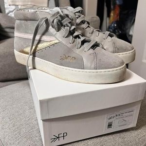 Freshly picked hard to find hightops with gold and white strip!